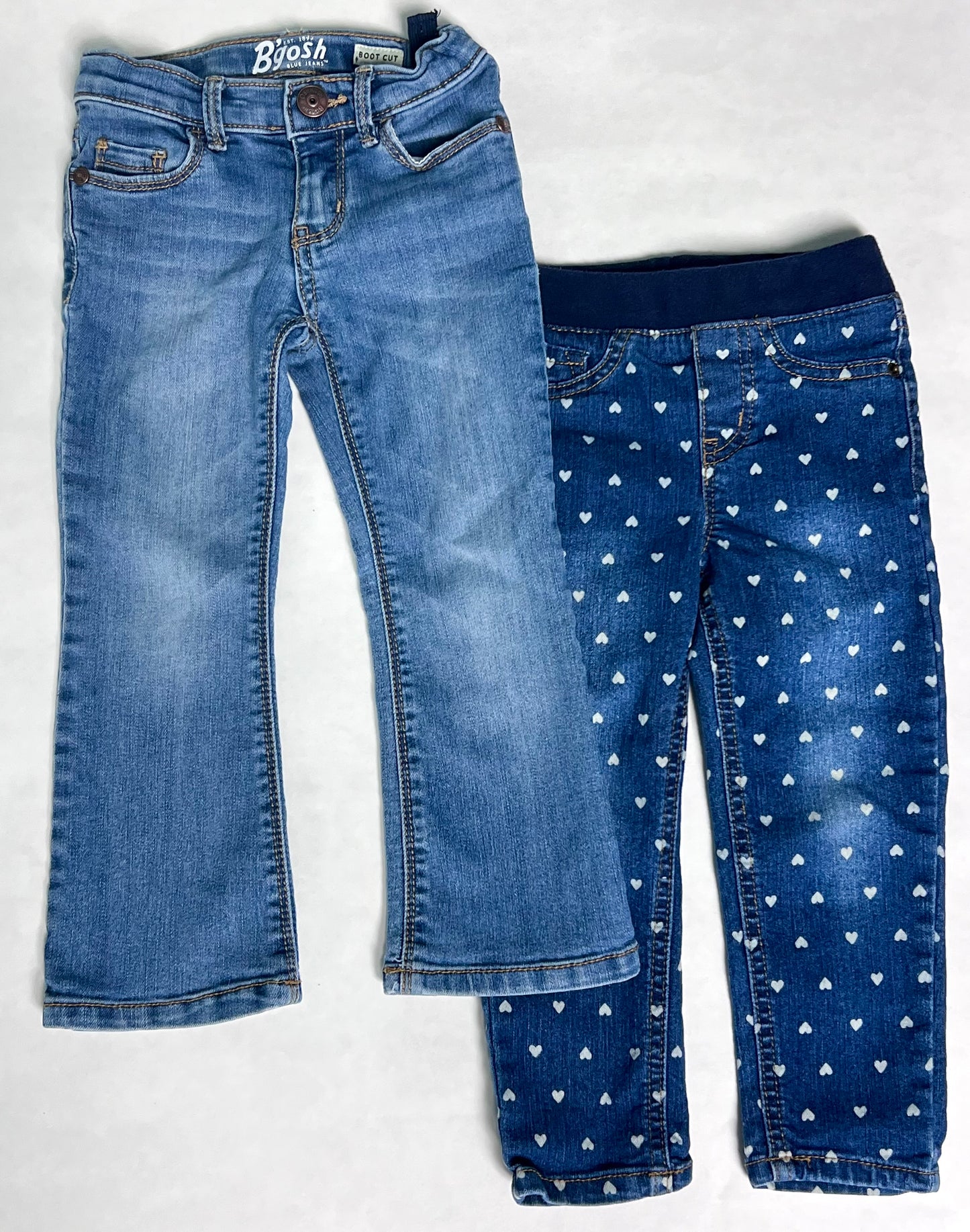 3T girls Osh Kosh B’Gosh boot cut medium wash denim with adjustable waist, VGUC. Cat & Jack dark denim with hearts and elastic waist, GUC. Toddler denim jeans bundle.