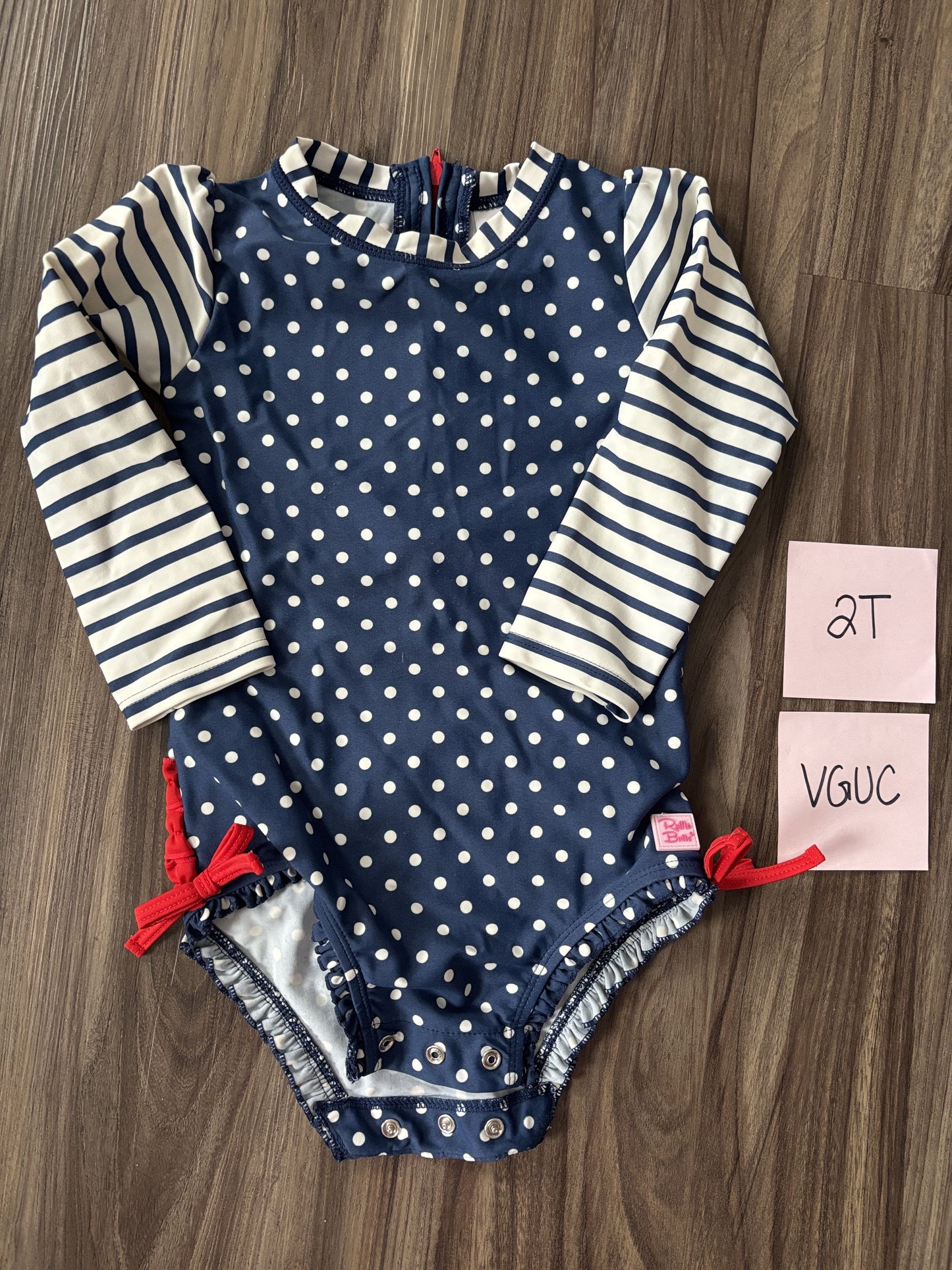#77 - 2T - VGUC RuffleButts - Navy/White Rashguard