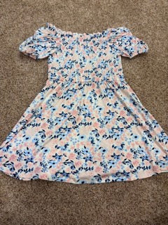#73 Girls size 7-8 BCBG dress , light pink background with pink and blue flowers
