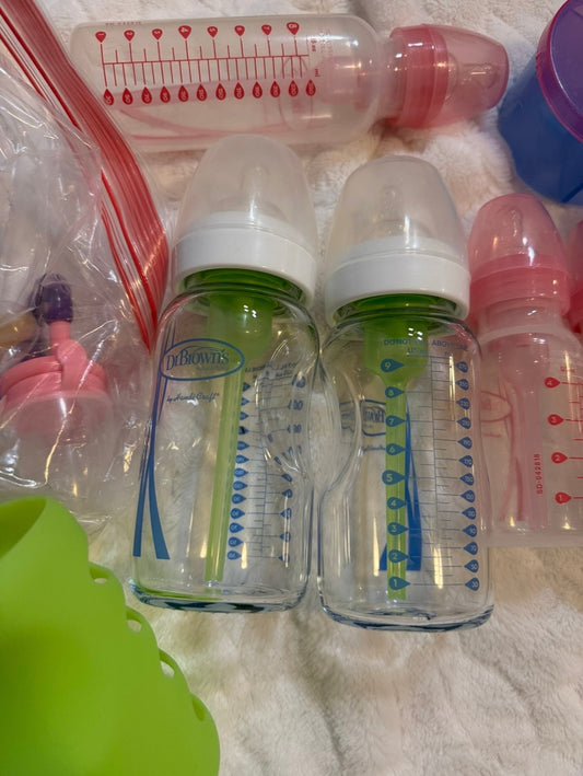 #53 multiple baby bottles and feeding supplies