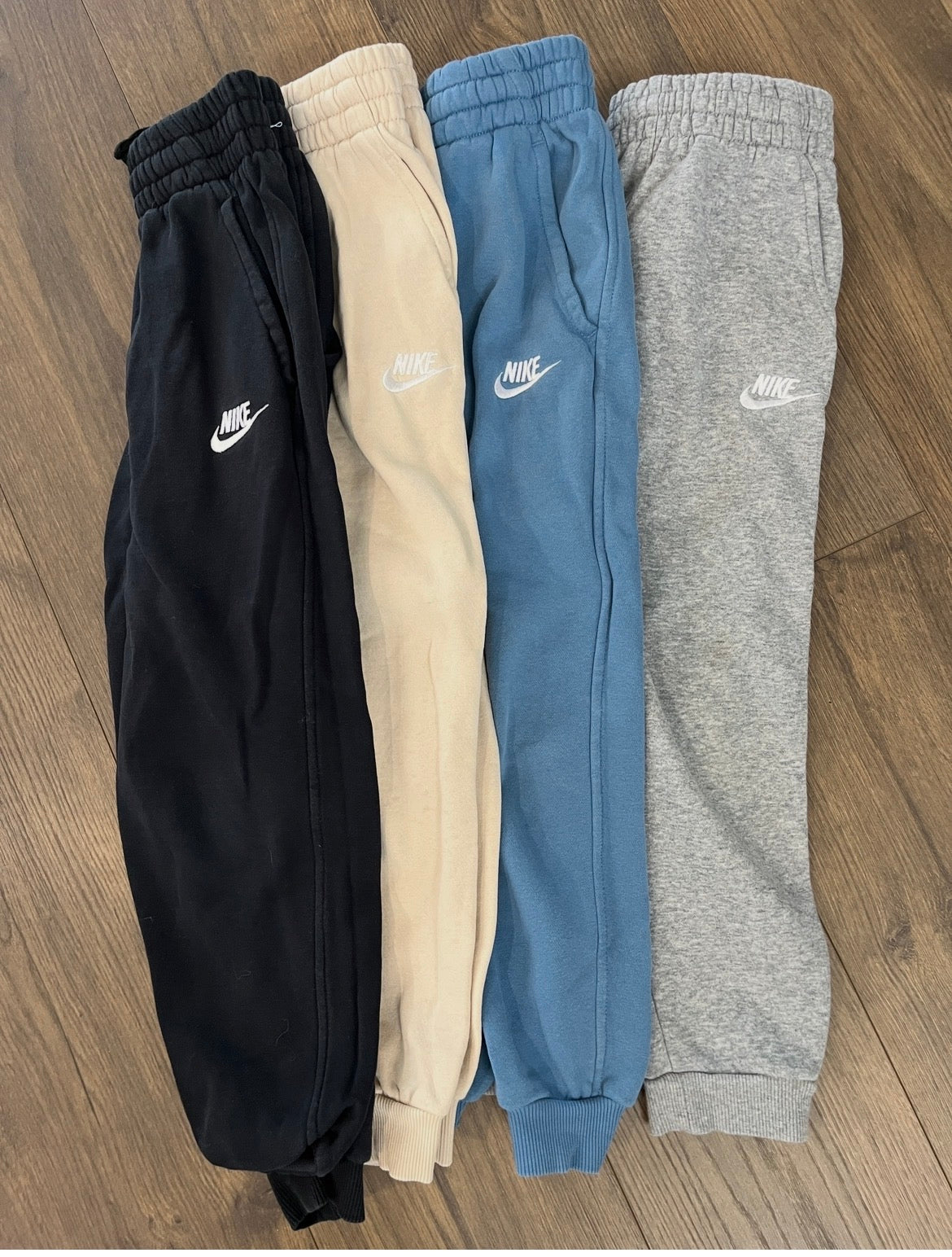 137 (4) pairs of boys youth small Nike sweatpants black, tan, blue, and grey EUC