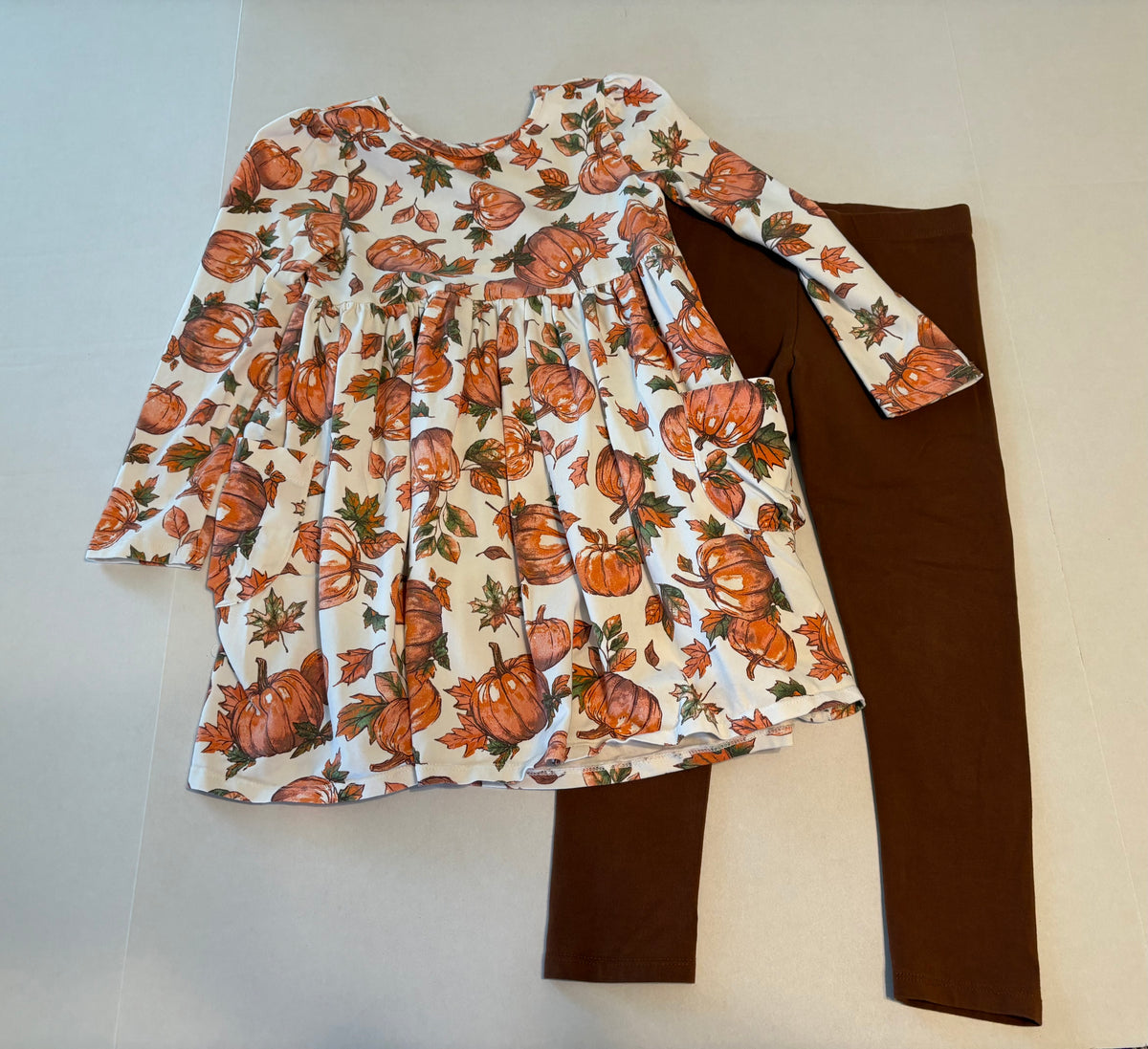 #25 Girls size 6 Flapadoodles pumpkin / fall themed outfit with long sleeve dress with cute bow detail on back and brown leggings