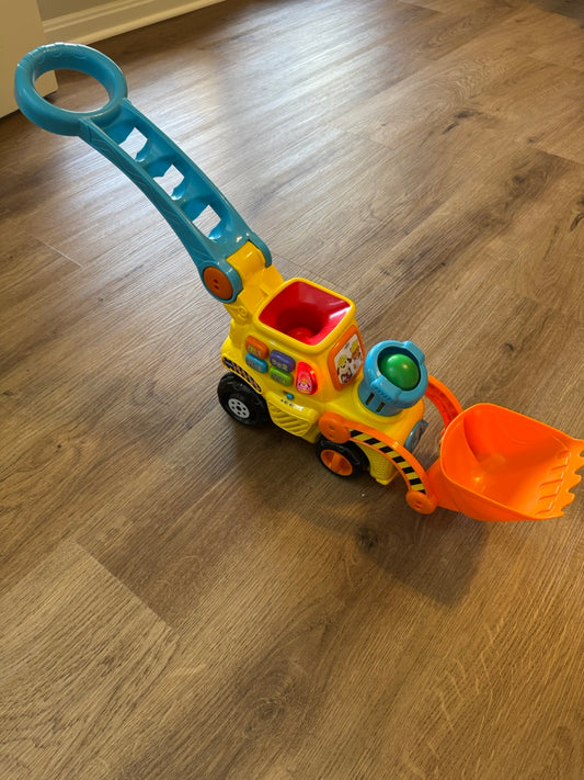 Seller #114 Vtech push and pop bulldozer