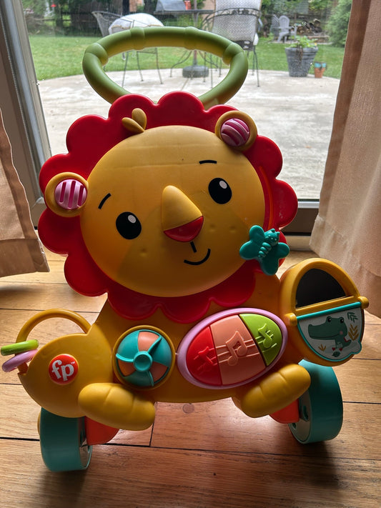 Seller 128 - Fisher Price Musical Lion Walker Toy
