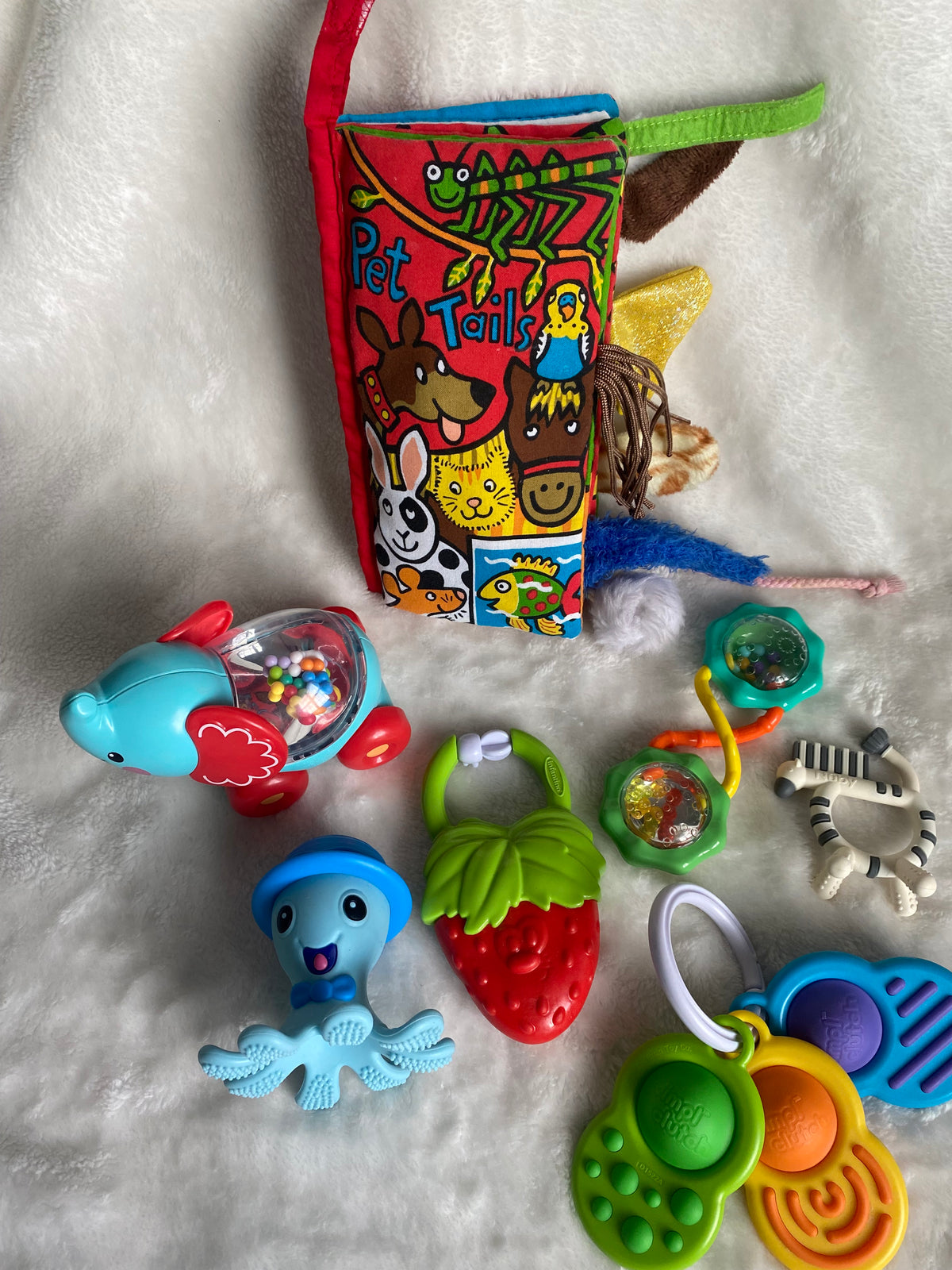 Seller 59 Pet tails book and asst teethers/toys