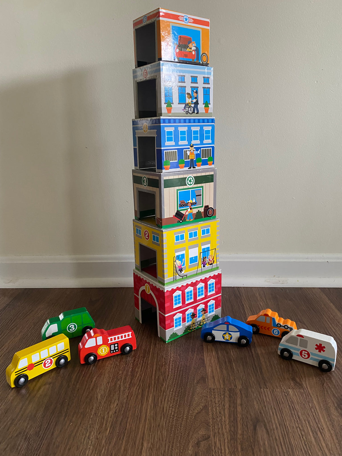 Seller 59 Melissa and Doug stacking/nesting garages with coordinating vehicles