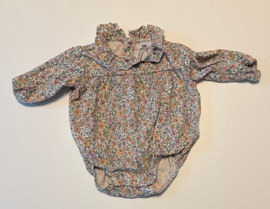 #93 H&M floral bubble girls size newborn