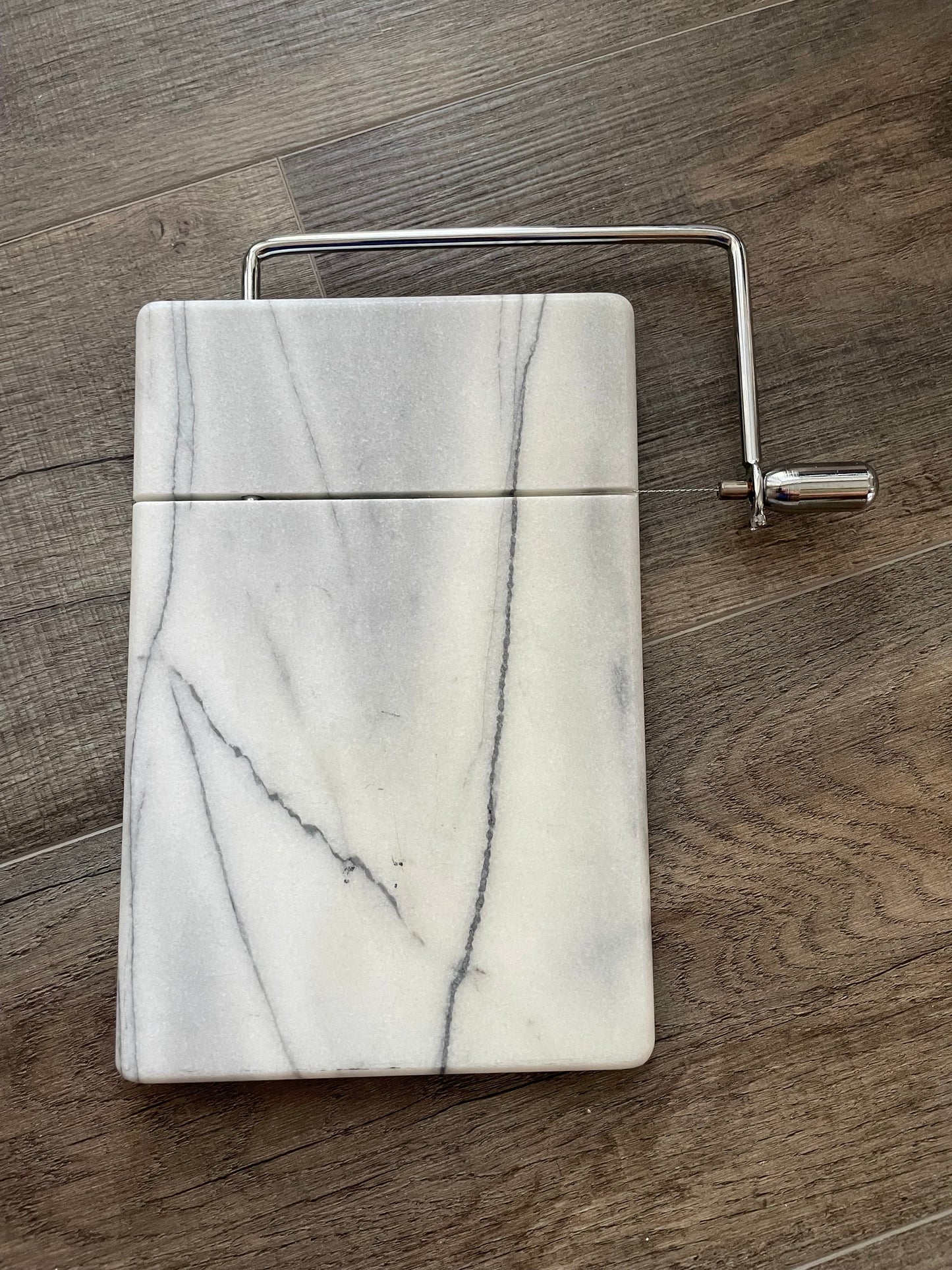 Seller 71: Crate and Barrel marble cheese slicer