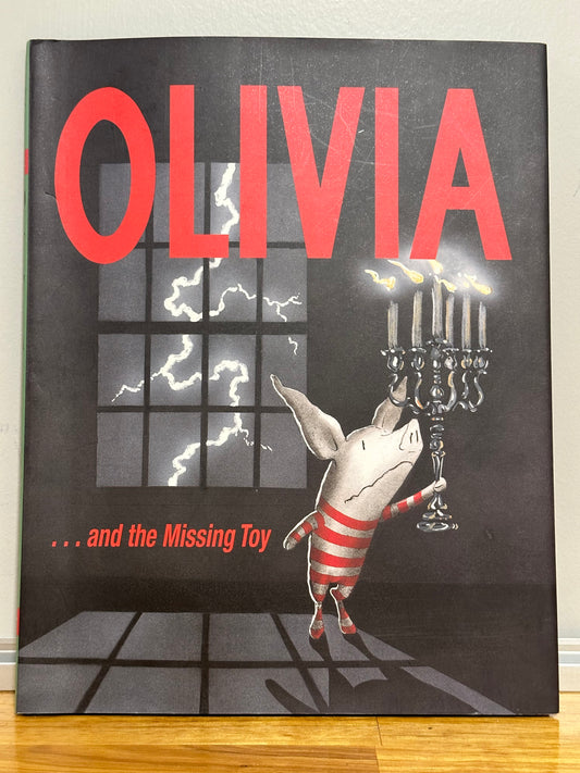 #95A Olivia and the Missing Toy hardcover book EUC