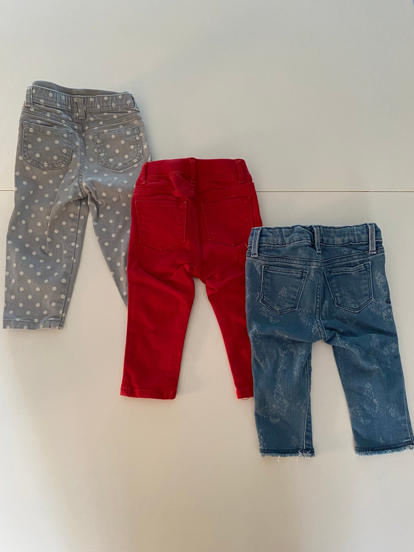 #84B- Toddler girl jean bundle, girls 12-18M, GUC, Gap jeans w/floral detail, Gap red leggings jeans w/heart patch over knee, Carter’s light gray jeans with white polka dots