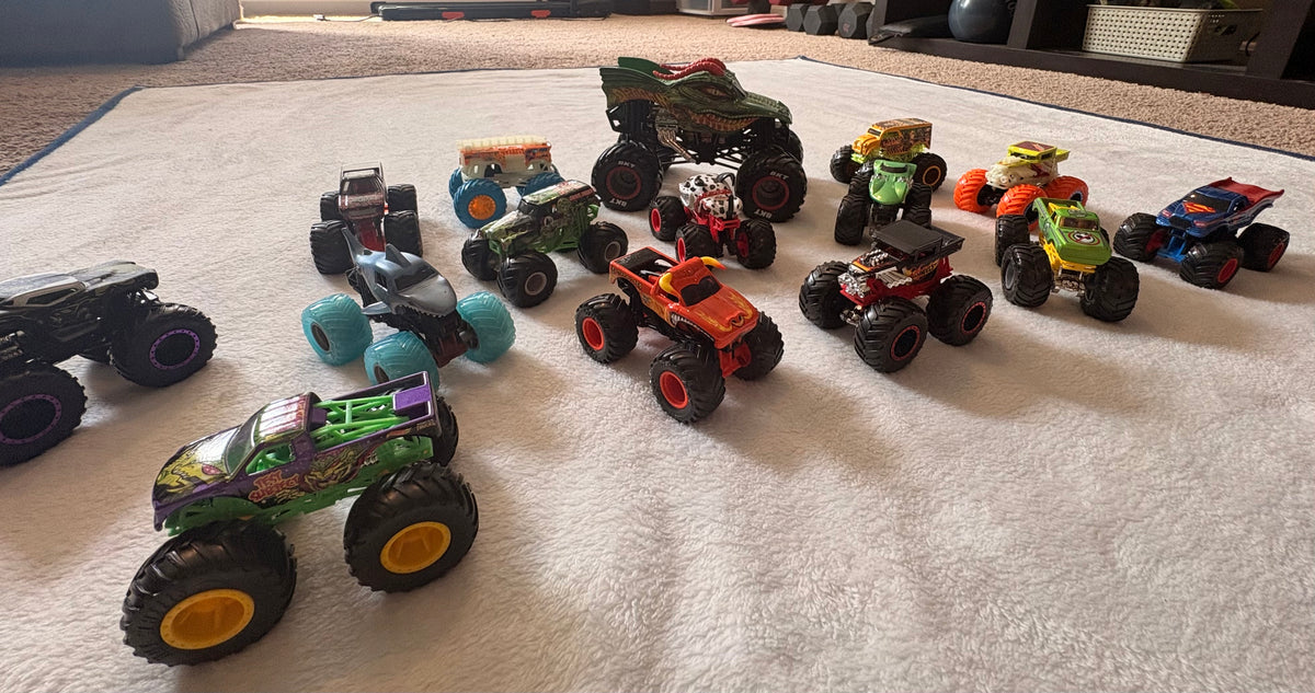 #102 - Set of 1 large and 14 small monster trucks