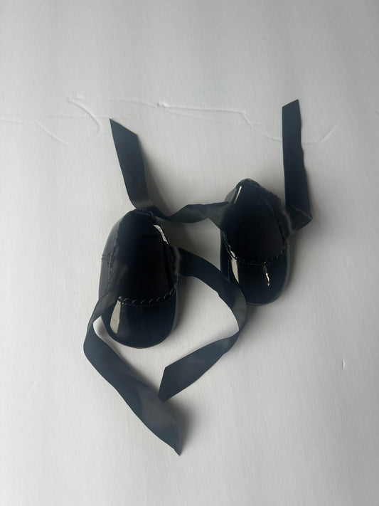 #180 girls size 0 black shiny crib shoes with ribbon ties