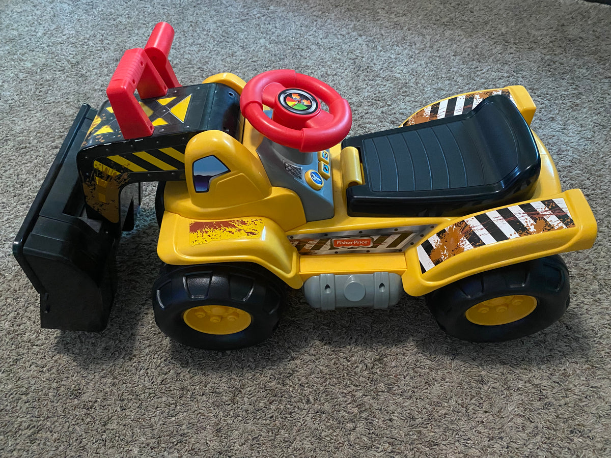 Seller #57 Fisher Price Ride on tractor