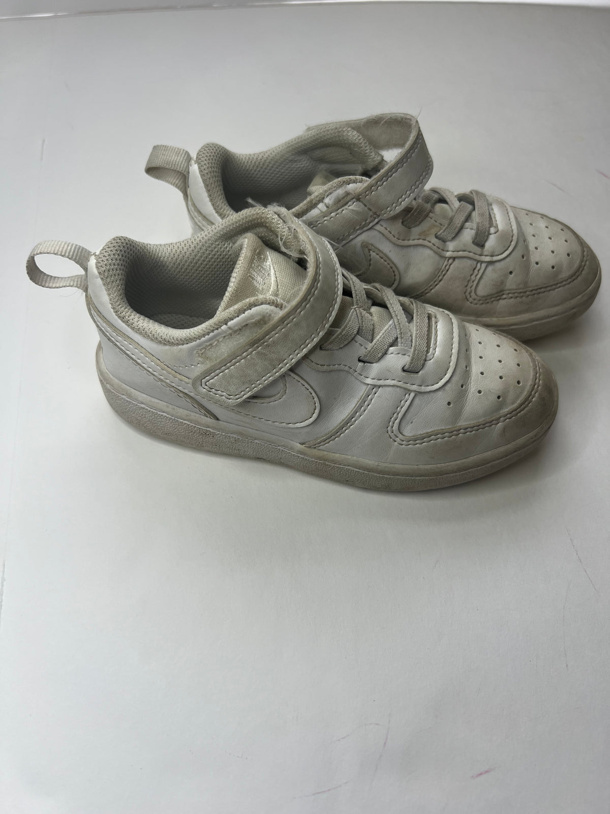 #180 Nike boys or girls size 10c white gym shoes