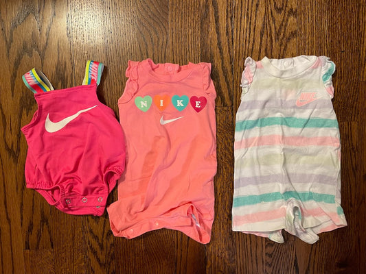 Nike baby girl size NB month bundle with pink swimsuit prink hear romper, and pink/green stripe romper