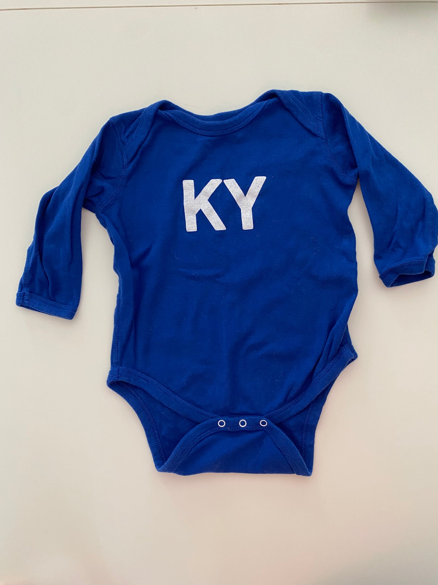 #84B-KY blue long sleeved onesie, gender neutral 18M, GUC