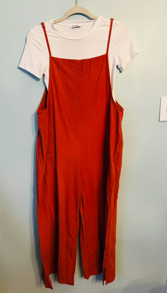 Jumpsuit (rust) AND bodysuit (white) Women’s Medium both bought at Amazon and never worn