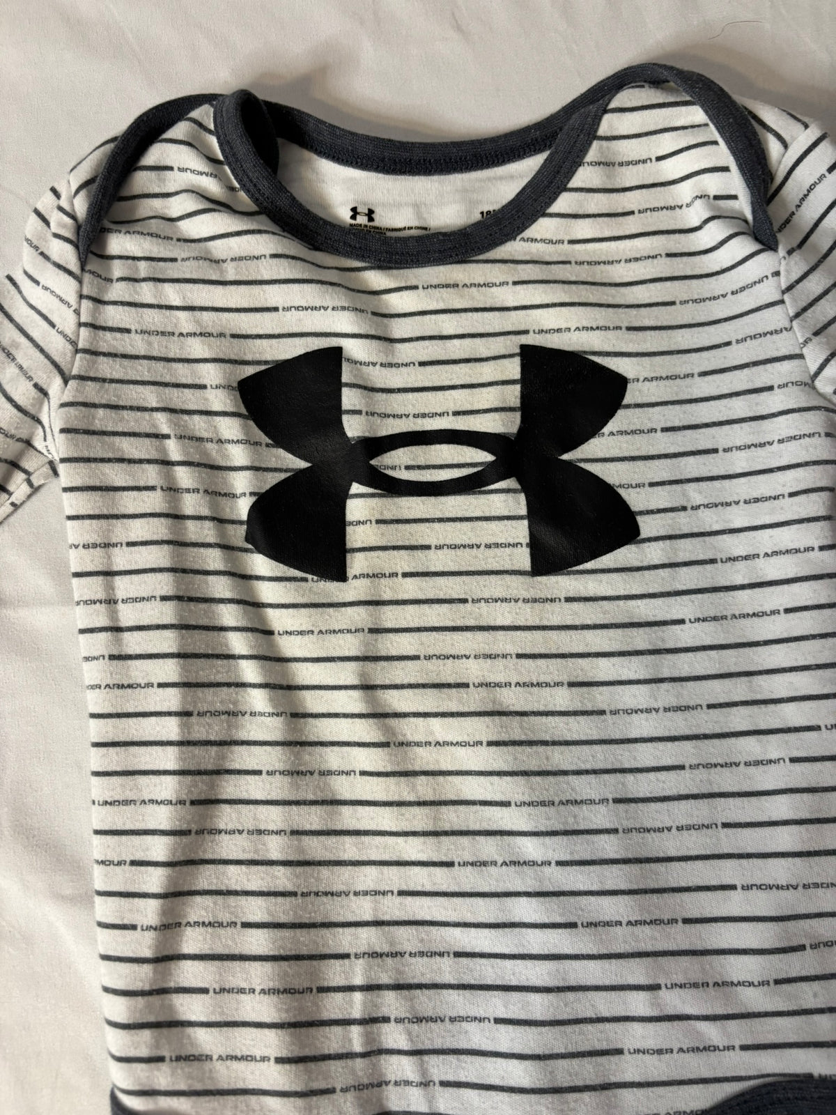 #90: Under Armor Long Sleeve Bodysuit – Black/White Stripe – Size 18 Months