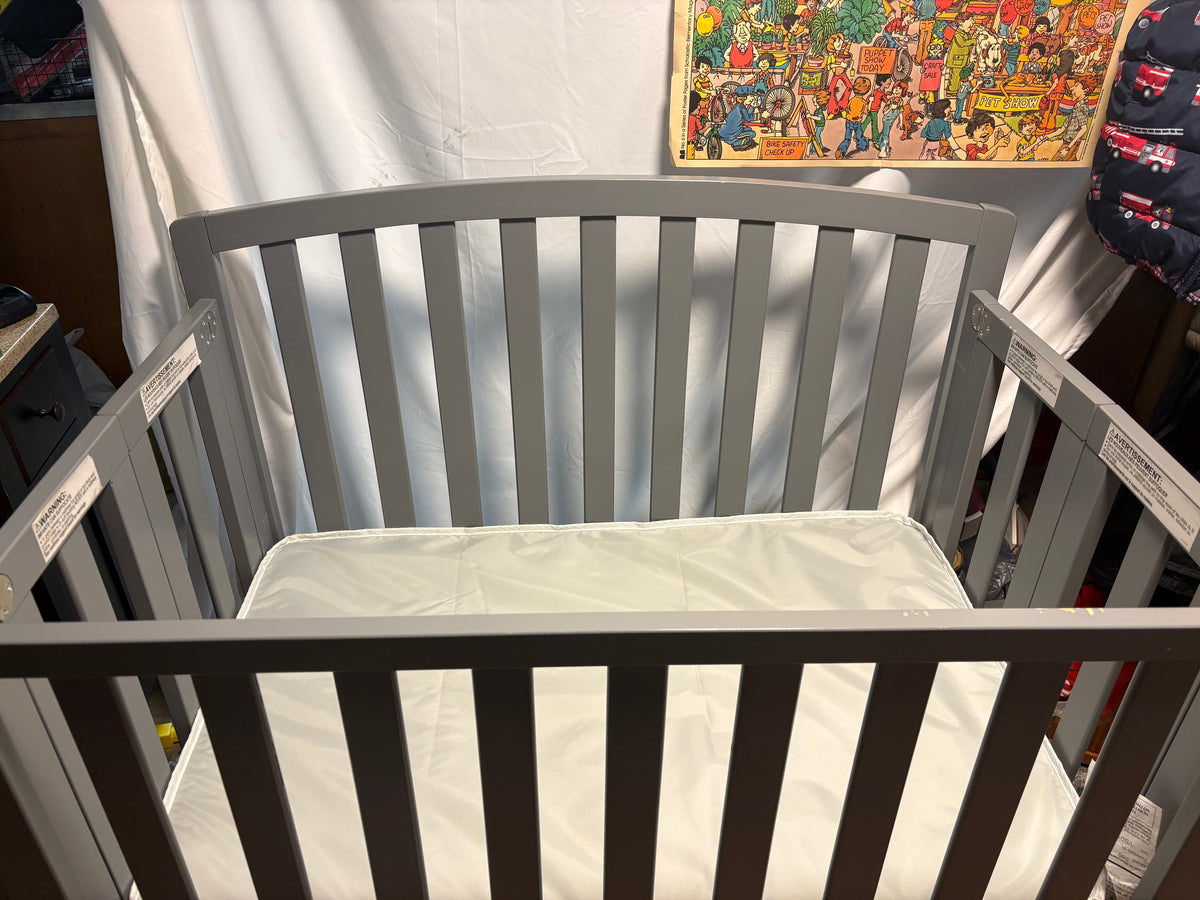 #34 Grey Delta Mini foldable crib with thick mattress
