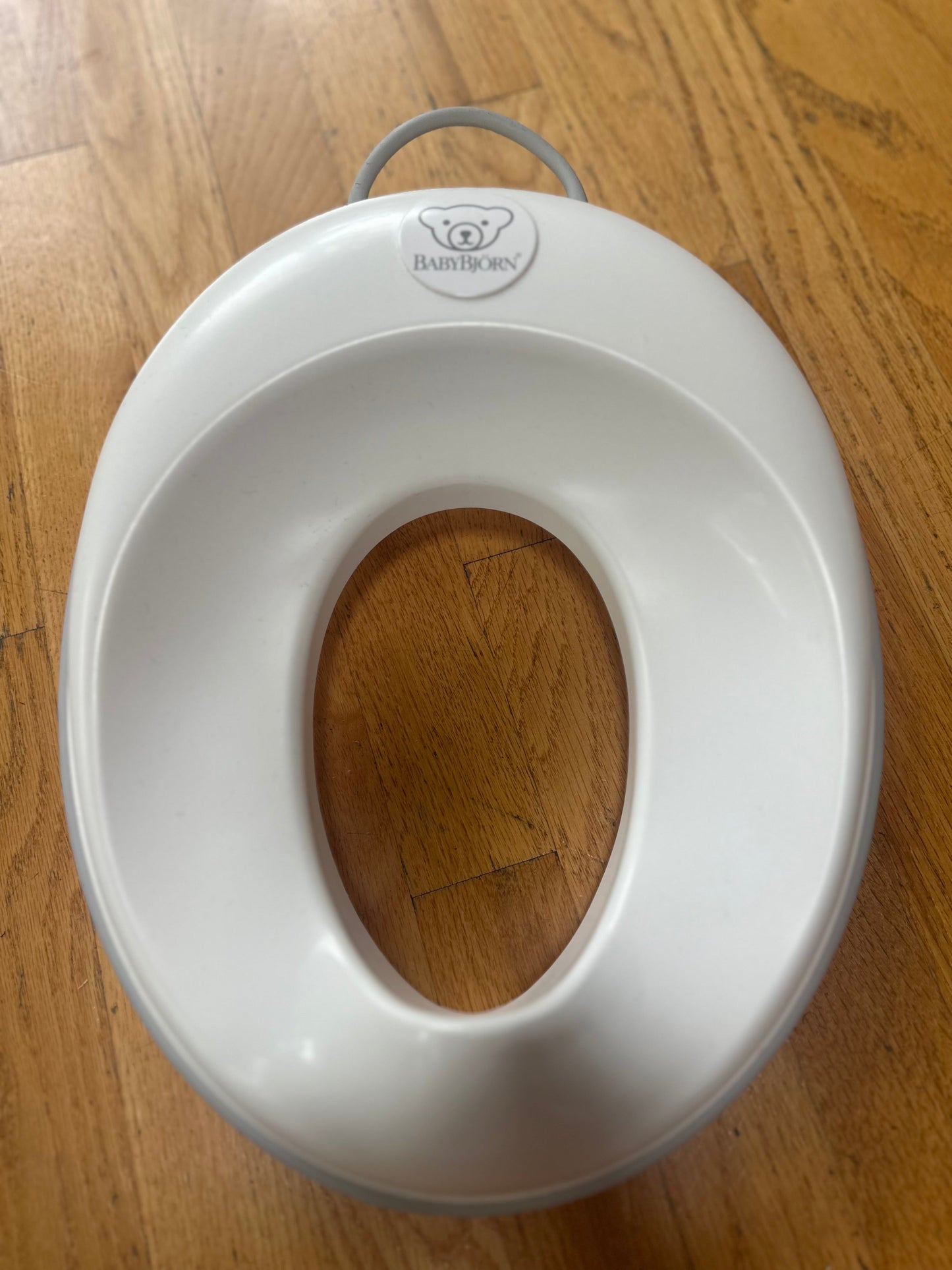 #104 baby Bjorn potty seat, grey trim