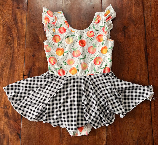 #66 4T Cheeky Plum skirted leotard (peaches with black and white gingham). GUC