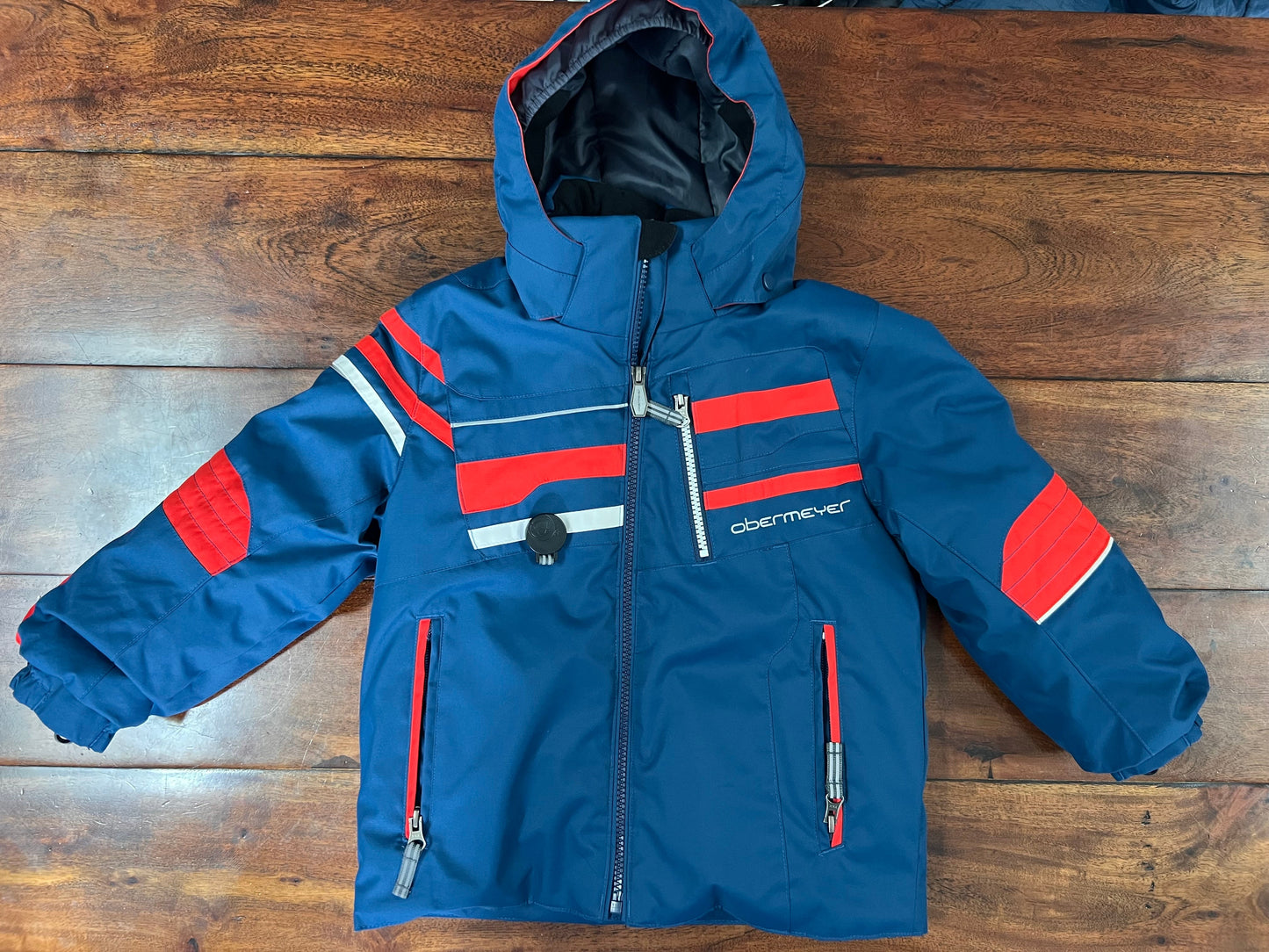 #66 4T Obermeyer hooded insulated winter coat. Waterproof and very warm! Blue and red. VGUC. Perfect for skiing and snow. (Retail: $140). *REDUCED*