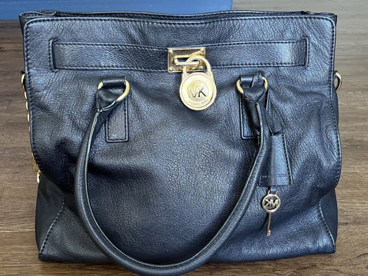 #124 Michael Kors Black Purse with gold accents