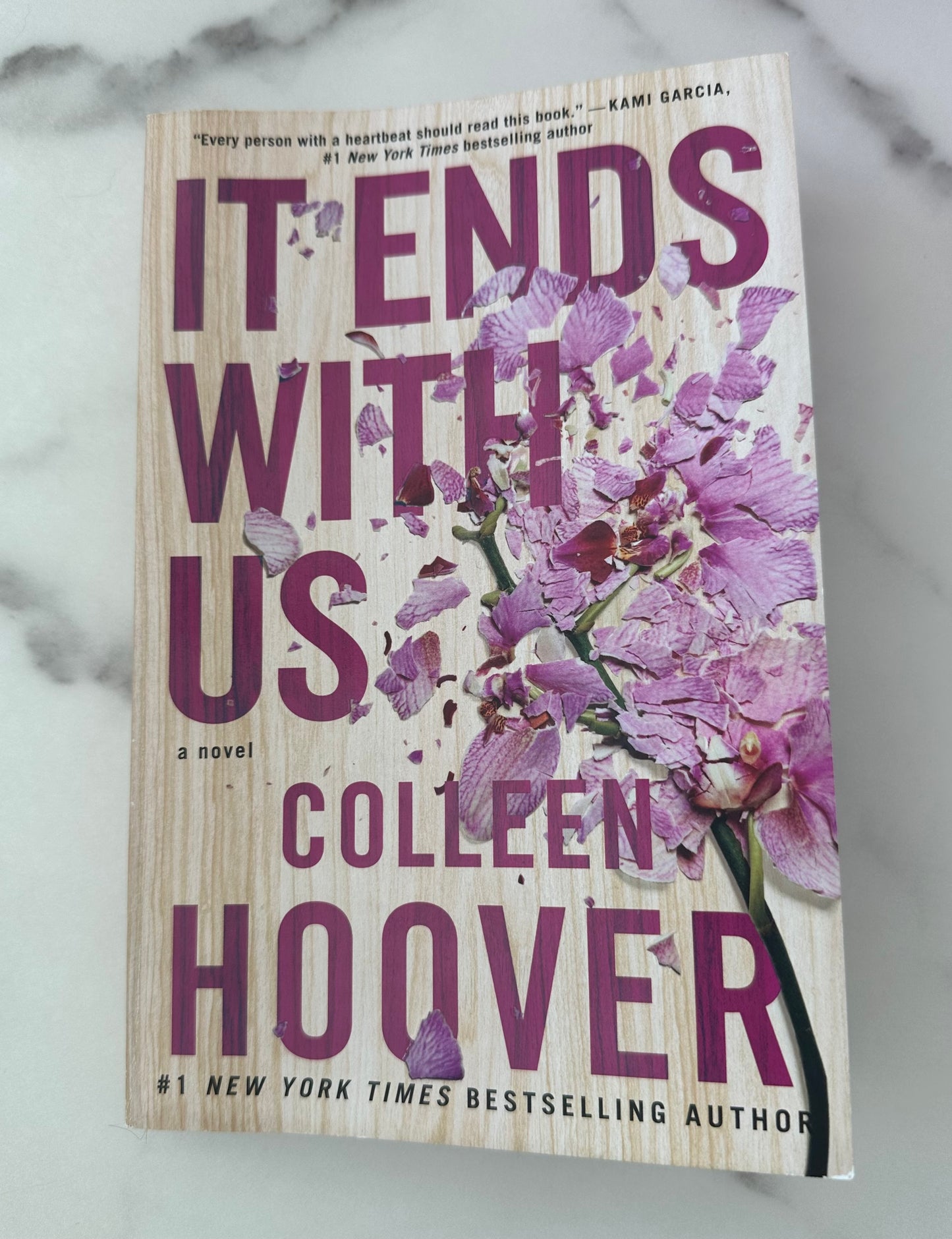 It Ends With Us paperback book by Colleen Hoover