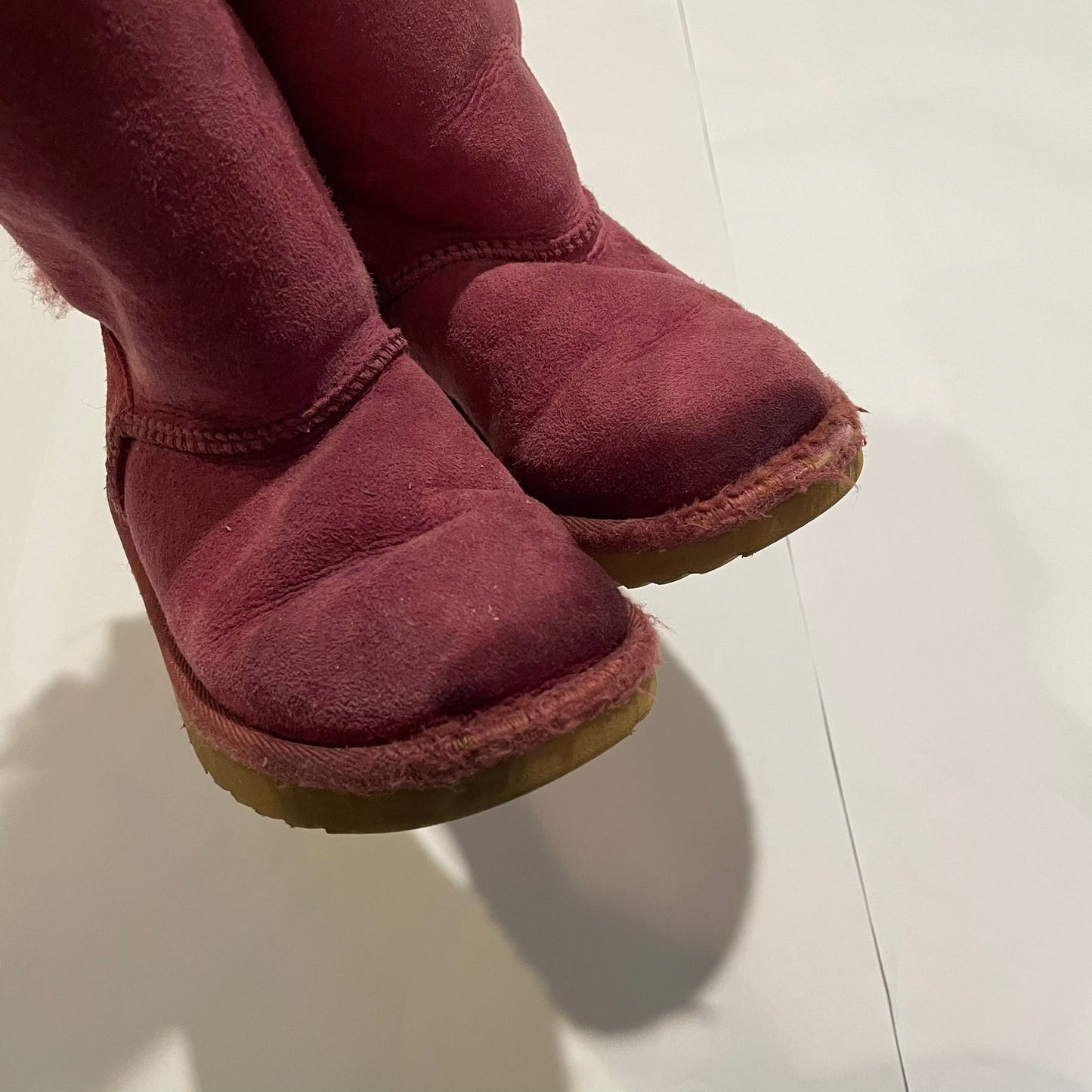 #126 Girls Uggs Sz 12 Dark Pink with bows Play
