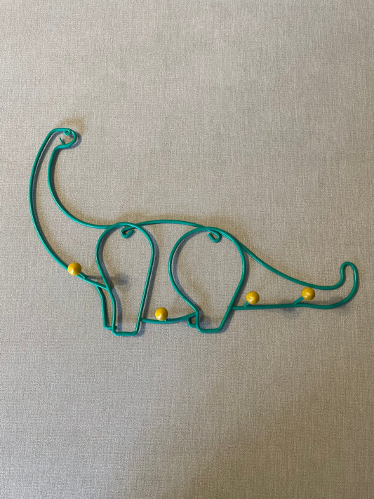 Seller #12 Vintage | Coated Metal | Green Dinosaur with Yellow Pegs | 17 inches x 11 inches