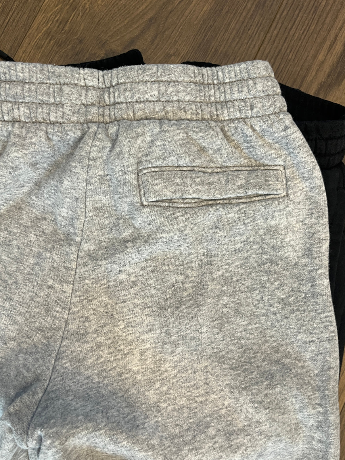 135 YM boys sweatpants 2 pairs of Black Jordan pants and 1 grey under Armour sweat pants, LN, all 3 have pockets (3 pairs total)