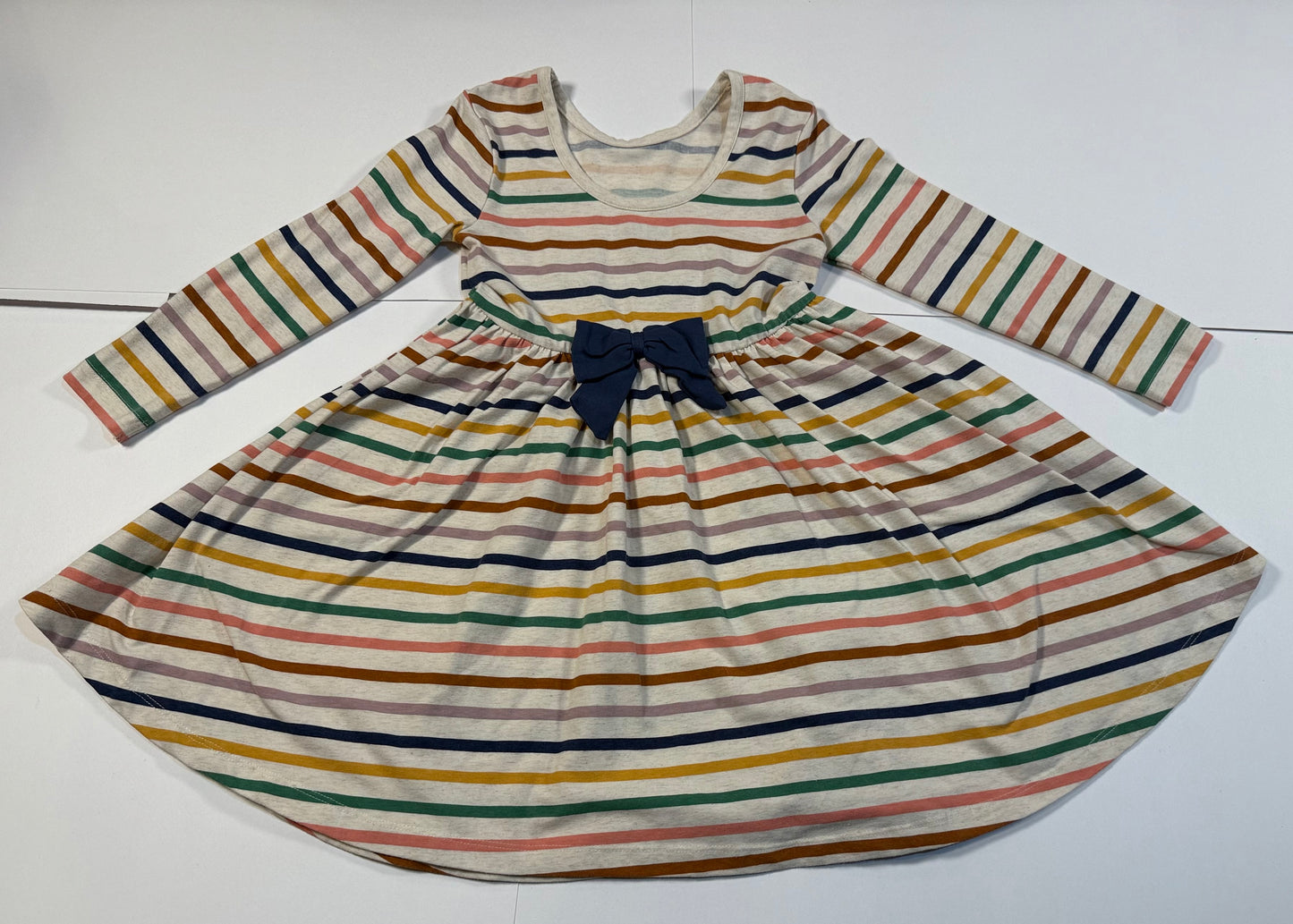 #180 Girls 5 Ruffle Butts Cream Dress with Rainbow Stripes. Cute Bow on Back and Pockets