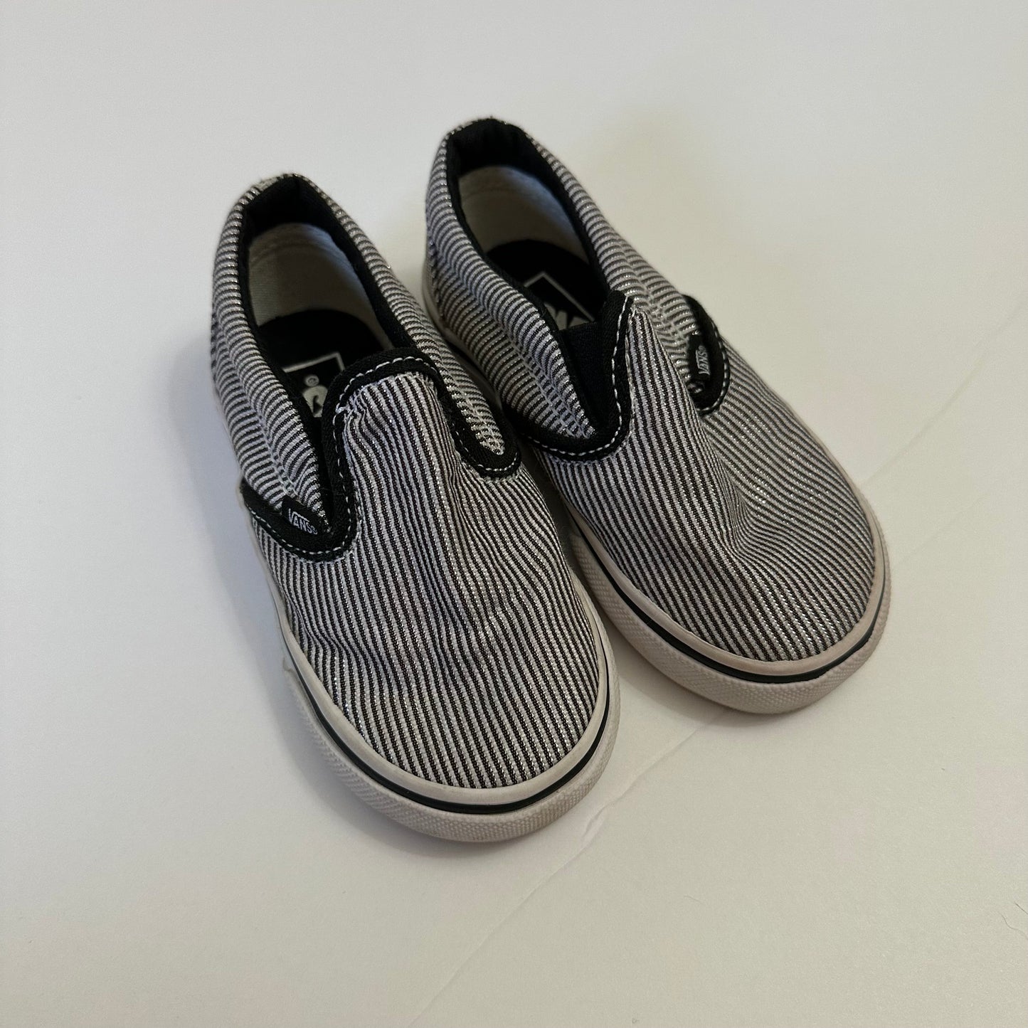 #162 Vans Black and Silver striped shoes size 6