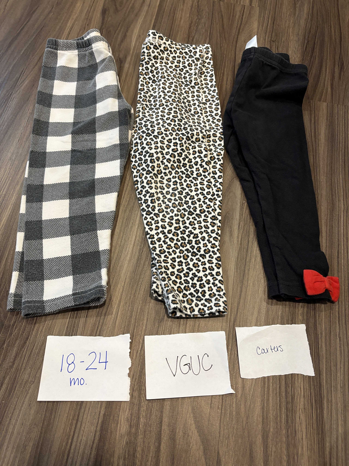#138 - 18-24 Mo VGUC (3) Carters Pants (black/white, leopard, red bow)