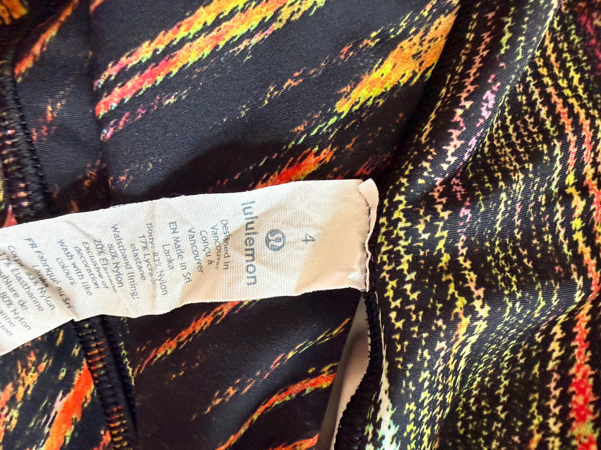 #143 Lululemon black & orange Wunder leggings women’s size 4