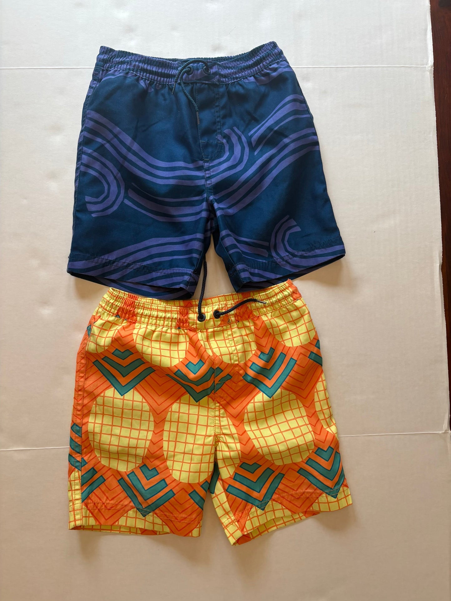 PPU Mariemont Seller 121 GUC for minor wear on back. 2 pairs Tea Collection swim trunks size 4