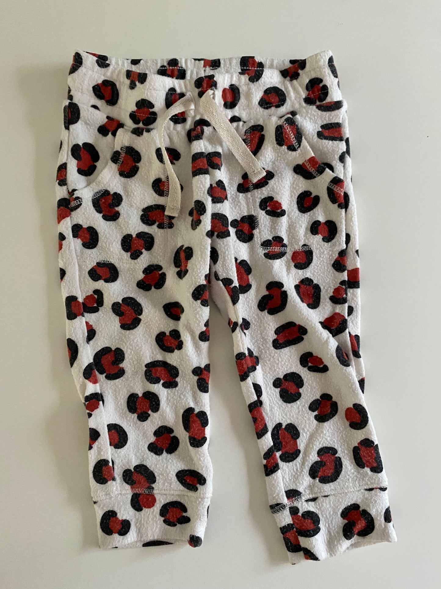 #84B- Girls 12M, Tea navy floral sweatpants and Cat&Jack leopard sweatpants, GUC