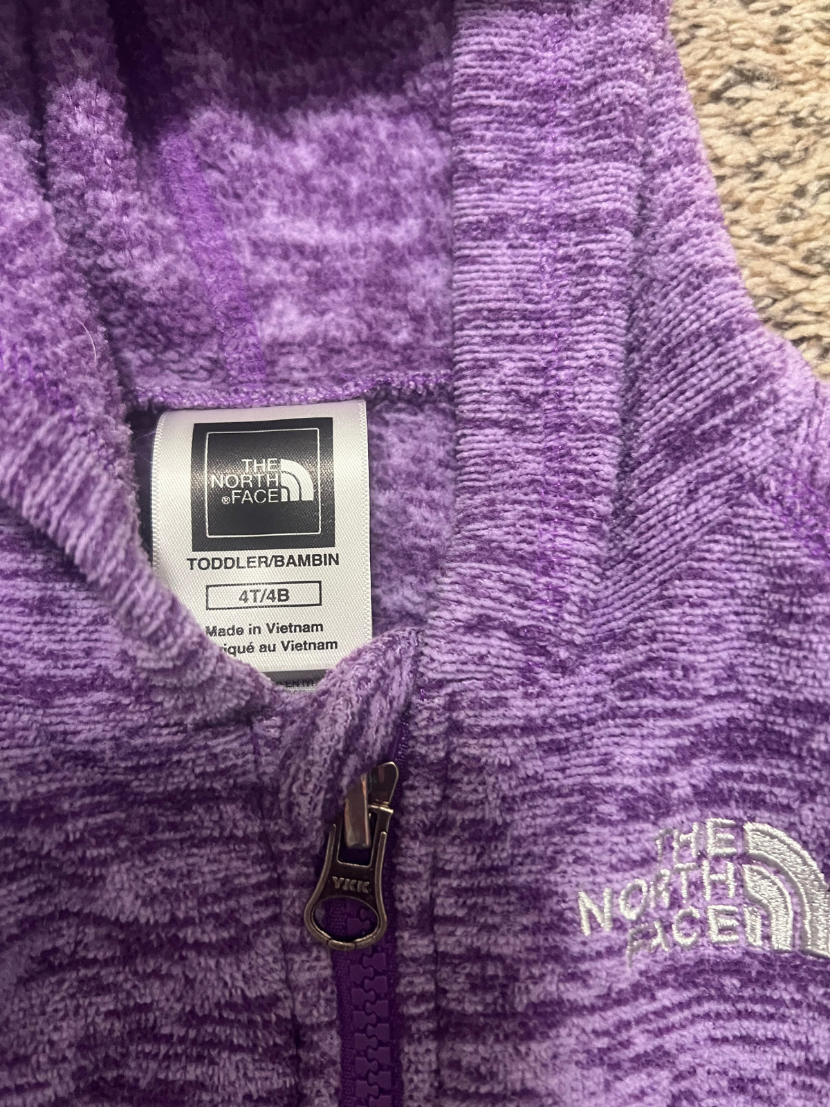 Seller #184 Girls Size 4T North Face purple zip up jacket