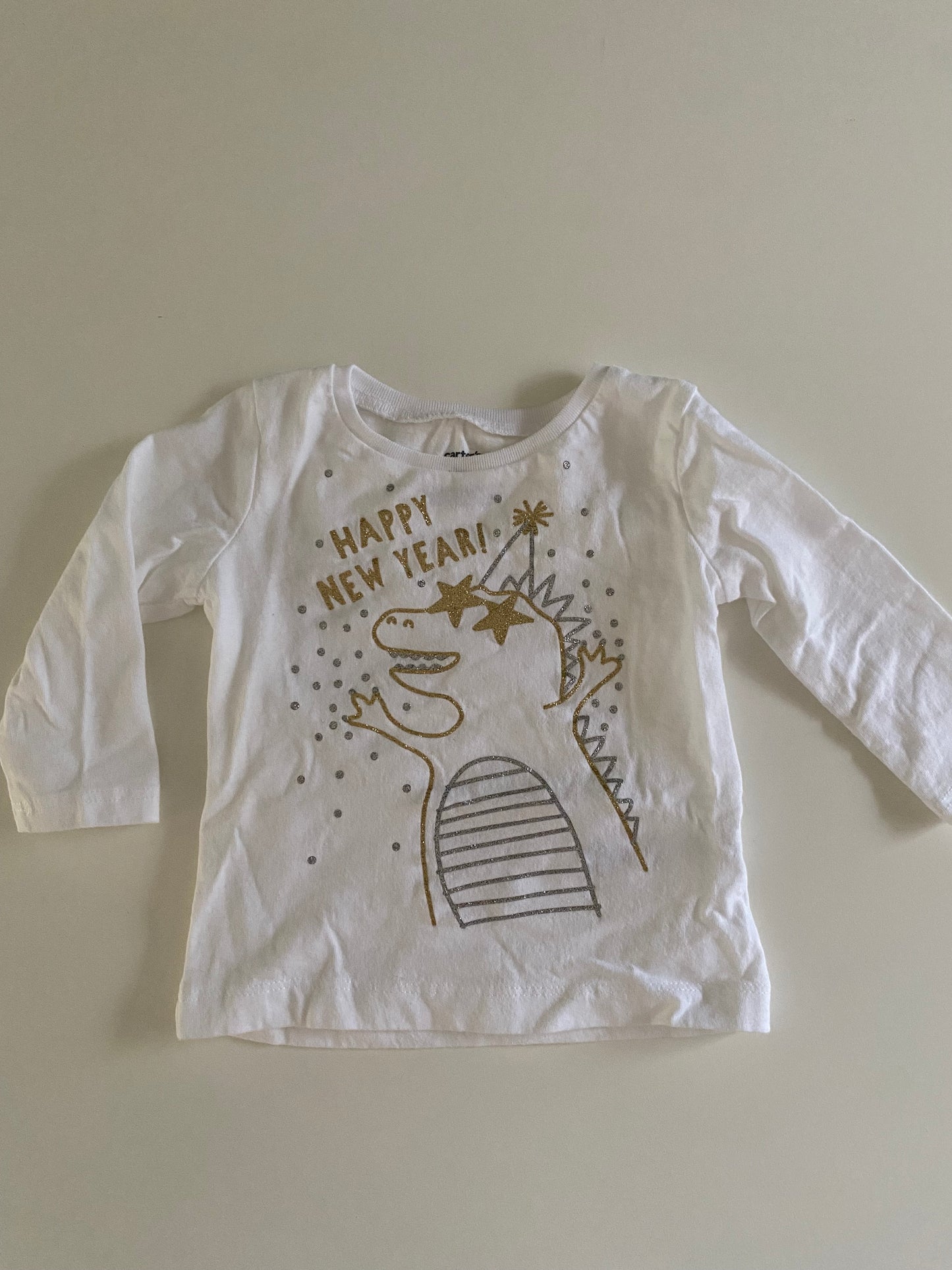 #84B- Girls 9M, Carter’s dinosaur happy new year shirt, EUC