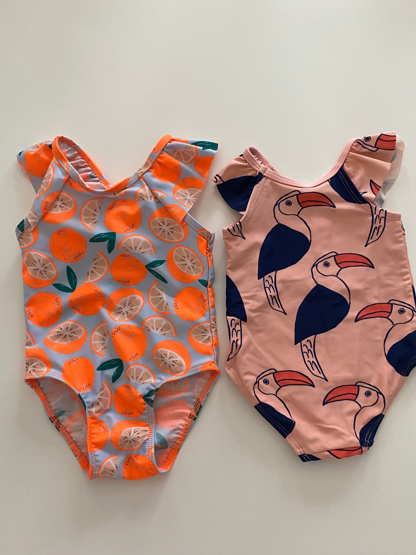 Tea Collection Tucan print swimsuit Girls 18M and Cat&Jack tangerine print swimsuit Girls 18M