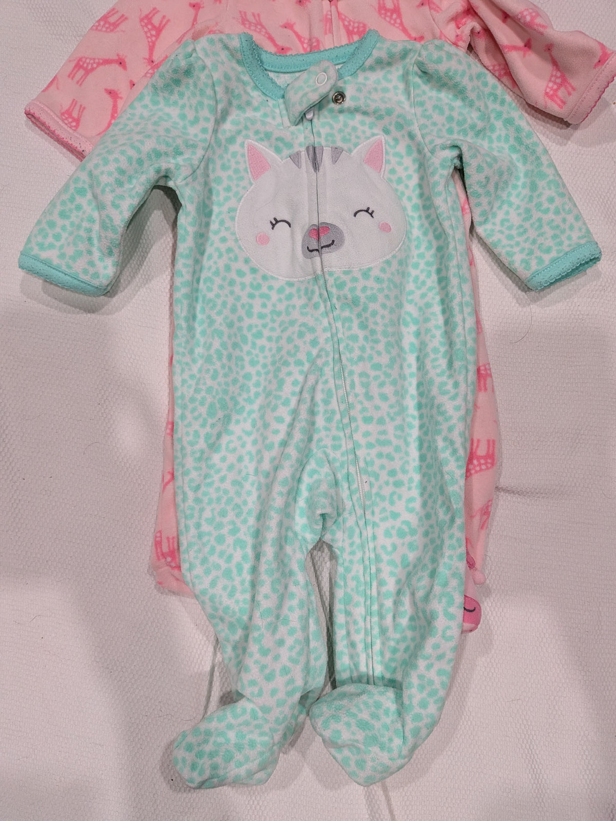 Seller 2. Carters fleece footie pajamas, size 3 months