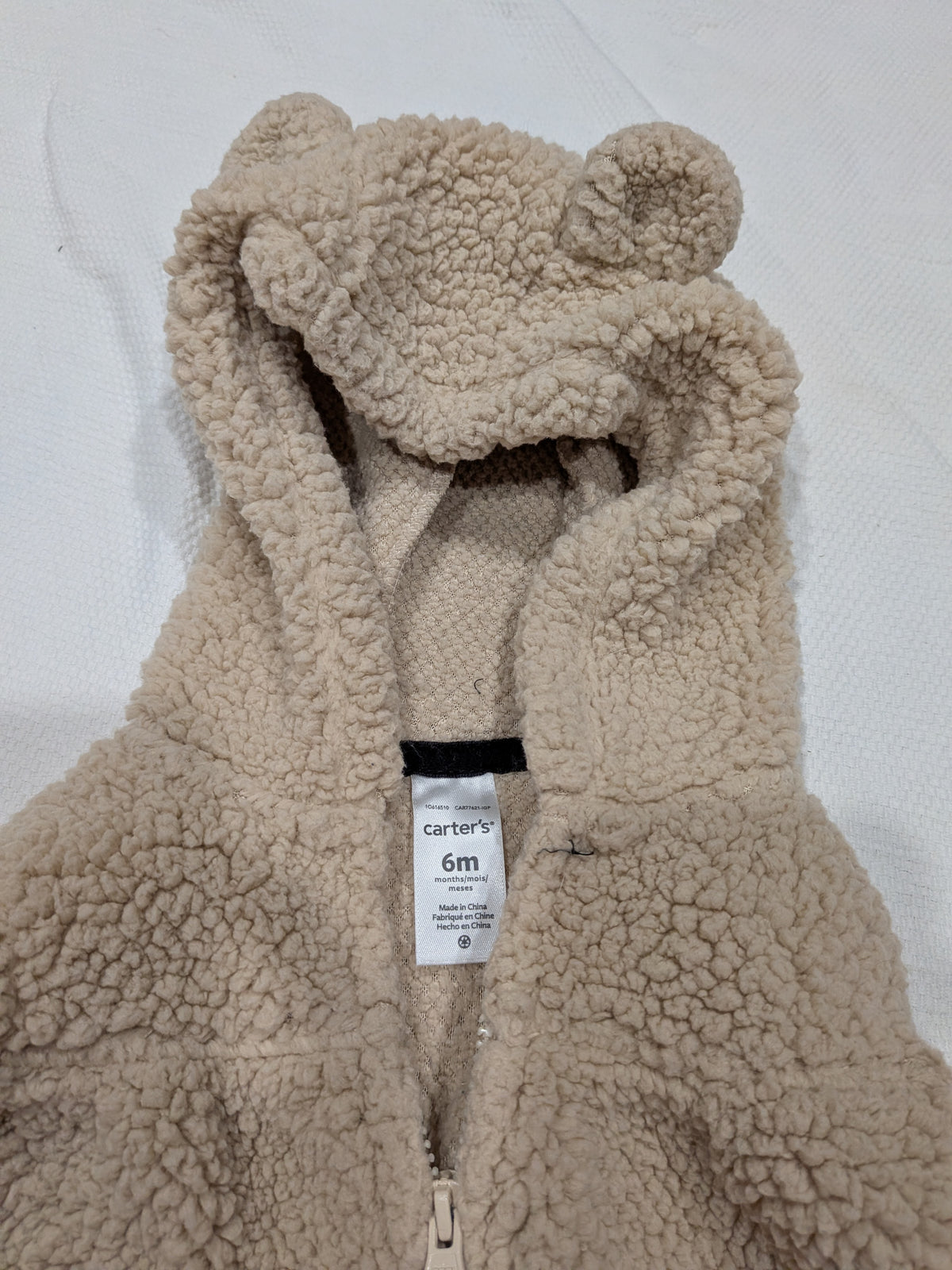 Seller 2. Carters vest 6 months