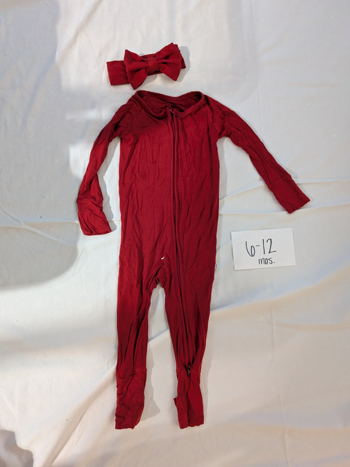 199 Little Sleepies red w/ LS bow 6-12 mos