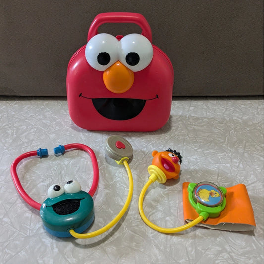 #61 Vintage Fisher-Price Sesame Street Elmo Giggle Medical Kit Doctor Toy Set