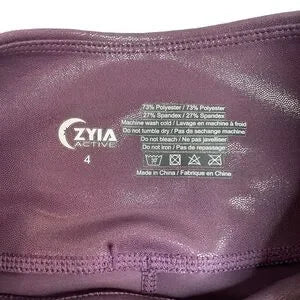 Seller 67 - ZYIA Active Plum Metallic Plus Light n Tight Hi Rise 7/8 24” Leggings Size 4