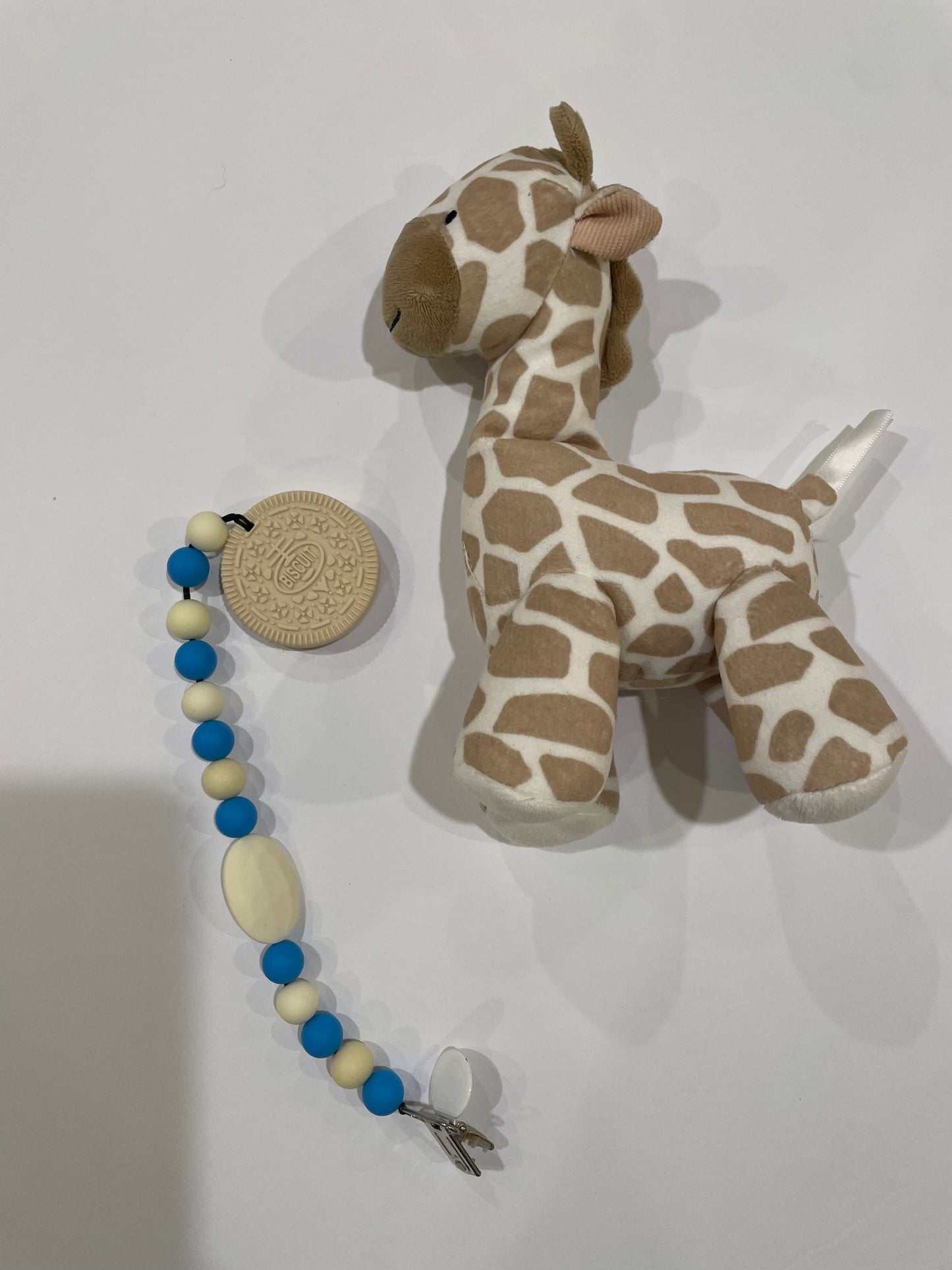 oreo teether toy and giraffe stuffed animal